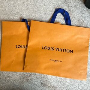 Louis Vuitton pair of shopping bags